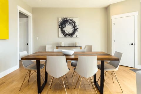 Enjoy meals in this bright, airy dining space that offers plenty of room and charm with modern accents and a warm, welcoming atmosphere.
