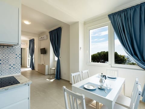 Furniture, Chair, Table, Outdoor Furniture, Outdoor Table, Porch, Kitchen & Dining Room Table, Balcony, Deck, Shade