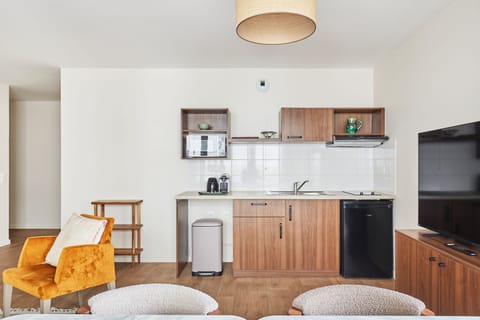 Fully fitted kitchenette with seating for four—prepare and enjoy meals together with ease.