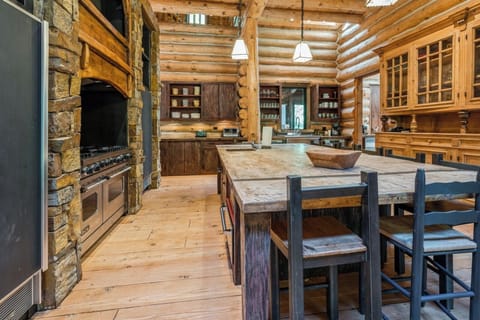 A rustic gourmet hub perfect for family feasts and fireside treats.