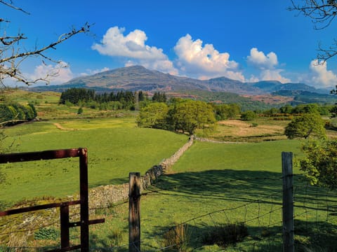 View from the bottom of the village, footpath leads down and away by the wall