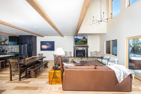 Windows frame the living room, providing breathtaking views of Whitefish Mountain Resort | Middle Level