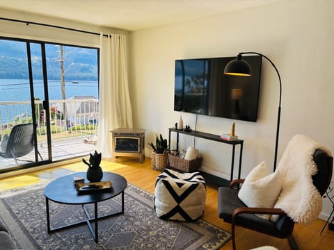 Main living area with 65 inch smart TV, Netflix and Prime video