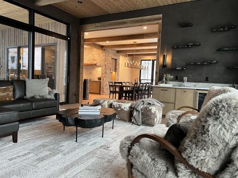 Grab a drink at the wine bar and take in the sunset alpenglow in the plush living room | Main Level