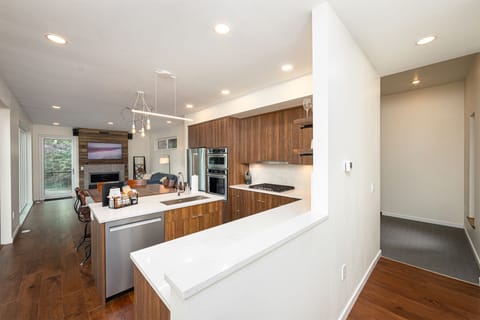 The open concept living area seamlessly integrates the kitchen, dining & living areas | Main Floor