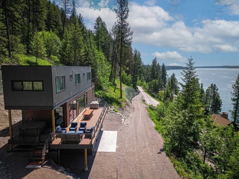 Perched on a hillside above Whitefish Lake, Larch Haus offers incredible lake & mountain views | Exterior