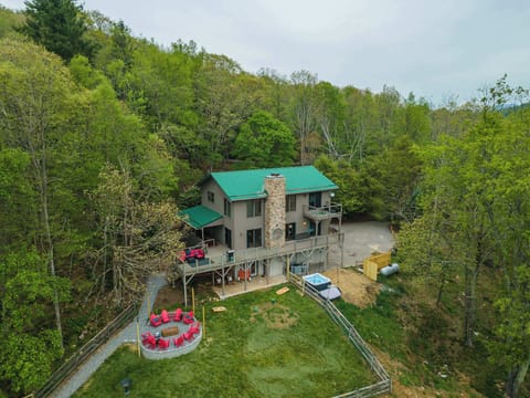 Take in the full view—from the expansive deck and outdoor dining to the hot tub and fire pit—everything you need for outdoor living and relaxation.

