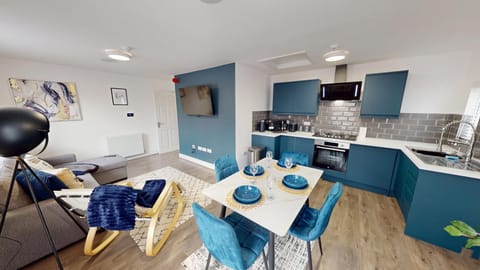 Open-plan kitchen, living, and dining area creates a spacious, social atmosphere.