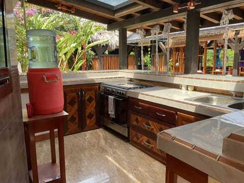 The outdoor kitchen has everything you need to cook or bring back take out.