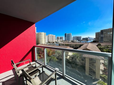 Clear view of Miami skyline and palm trees from the balcony.