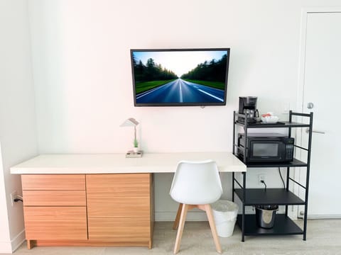 Functional workspace with Smart TV and modern decor.