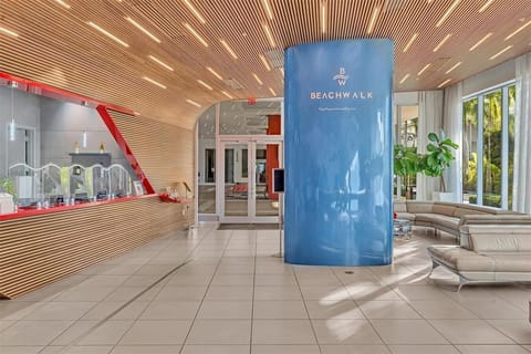 Welcoming lobby with elegant wood flooring and artistic touches.