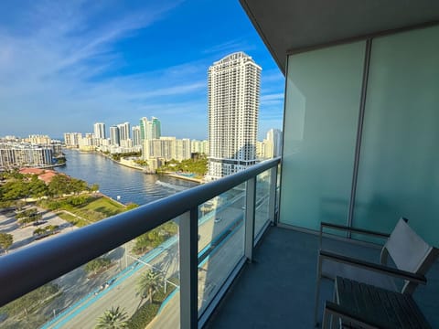 Private balcony with outdoor seating and skyline views.