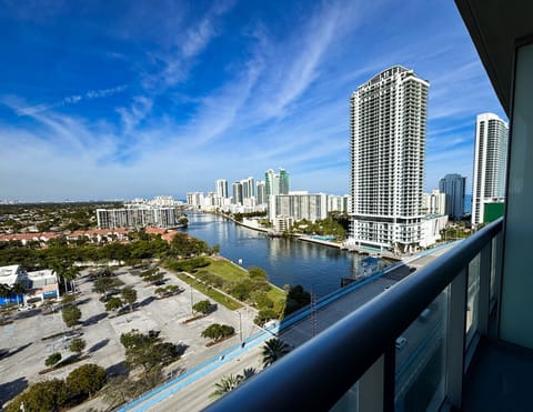 Private balcony with outdoor seating and skyline views.