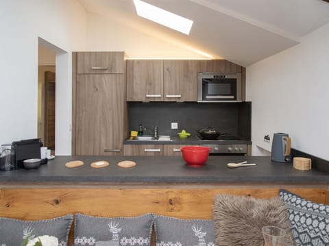 Furniture, Interior Design, Wood, Flooring, Floor, Ceiling, Room, Countertop, Kitchen, Cabinetry