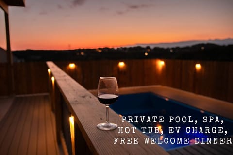 Enjoy the beautiful sunset and the pool with a glass of wine!