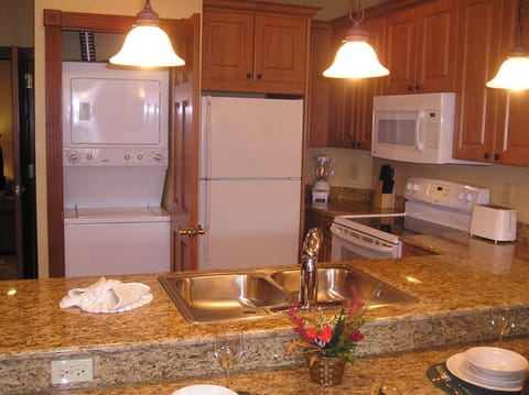 Washer and dryer in storage closet in Grand kitchen