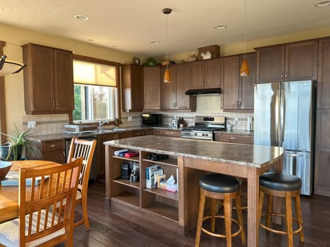 Kitchen: gas range stove, high-end appliance's, dishwasher, tones of cupboards.