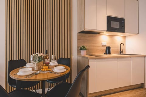 Modern kitchen and dining – enjoy home-cooked meals after your day at the Baltic beach.