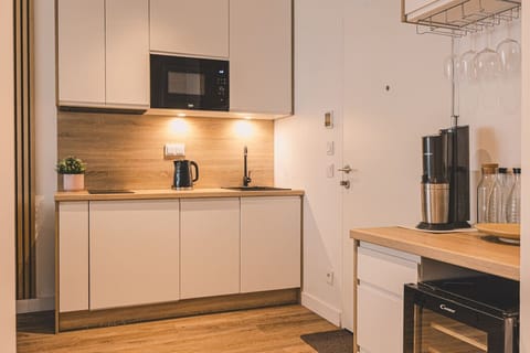 Balcony with forest view – perfect for a morning coffee or an evening drink for two.