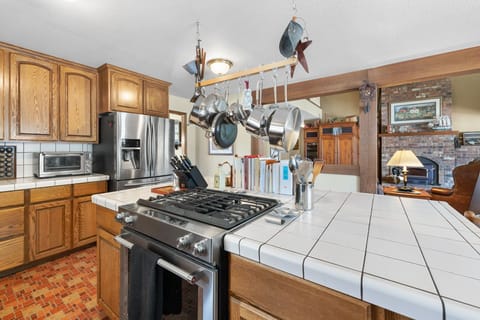 Bright airy kitchen close to the living room and deck and all the fun.