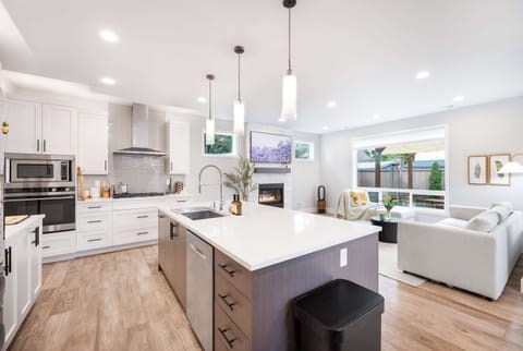 The kitchen is a chef’s dream, blending modern functionality with timeless aesthetics.