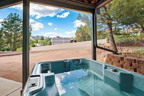Soak your worries away in the private outdoor hot tub with a view.