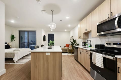 You’ll love the convenience of this fully equipped kitchen, where you can brew coffee, cook meals, or prepare snacks. The cozy layout and warm ambiance make cooking here a delightful part of your stay.