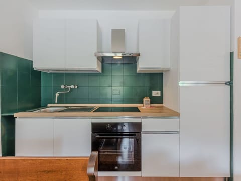 Kitchen Appliance, Kitchen, Countertop, Major Appliance, Cabinetry, Interior Design, Flooring, Wood, Home Appliance, Kitchen Stove