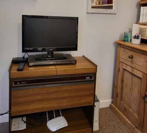 flat screen tv and dvd player, wifi box, xbox console