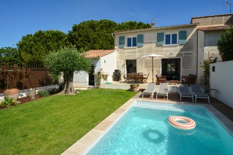 House with private pool and fenced garden.