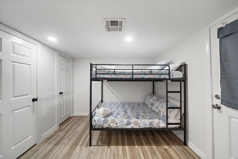 This bedroom has a queen-over-queen bunk bed
