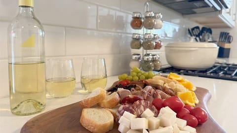 Spacious kitchen ready for cooking or serving meals. (food here not included)