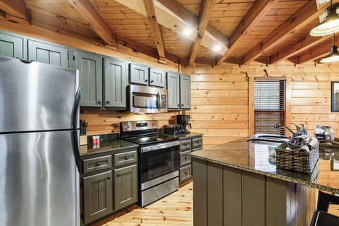 The kitchen has stainless appliances and plenty of counter space.