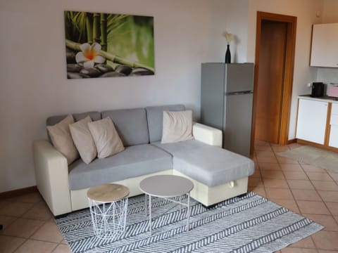 Furniture, Interior Design, Flooring, Floor, Wood, Couch, Room, Textile, Living Room, Lighting