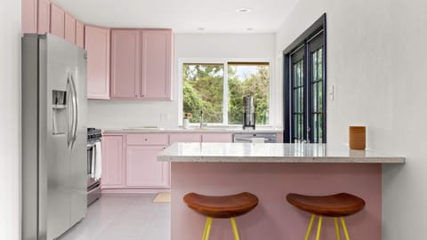 Vibrant Kitchen with breakfast bar island and bar stools