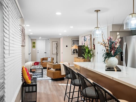 Bright, open layout with designer touches ✨ From the kitchen island to the cozy lounge, this space invites you to relax, cook, and connect! 🛋️🍷