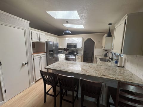 Fully equipped kitchen w/ garbage disposal, gas range/oven & side by side refrig