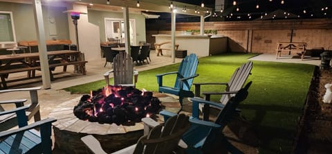 N/W facing view of the back yard at night. All the lights are on.