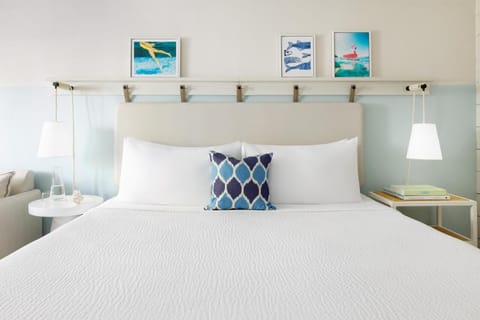 Sink into crisp linens and drift off in coastal calm.