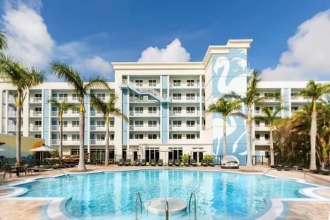 Arrive to a vibrant resort oasis wrapped around a shimmering pool.