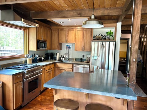 Fully stocked kitchen with coffee bar, & stainless steel Thermadore appliances.