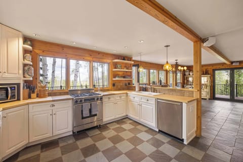 Kitchen: Main floor, Dacor oven, Jenn-Air fridge, drip coffee maker, French press, blender, toaster oven, food processor, cooking utensils, tableware