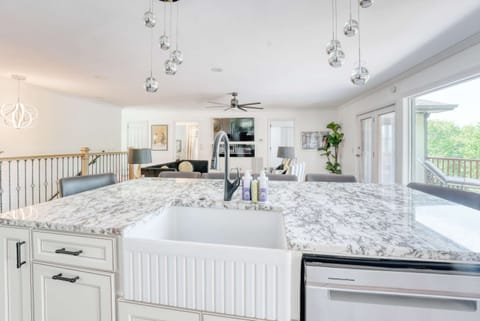 Contemporary style infused with warmth defines this beautifully crafted space. The dance of light and shadow adds depth and an inviting atmosphere.