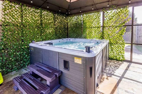 Relax and unwind in this cozy hot tub oasis!