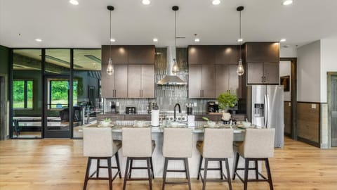 Ample of counter space in the open-concept kitchen, with direct access to the bowling/golf simulator room