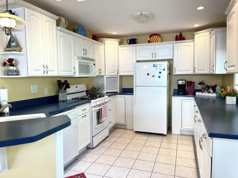 Cook up a feast in the well stocked kitchen with plenty of counter space for all your culinary creations.
