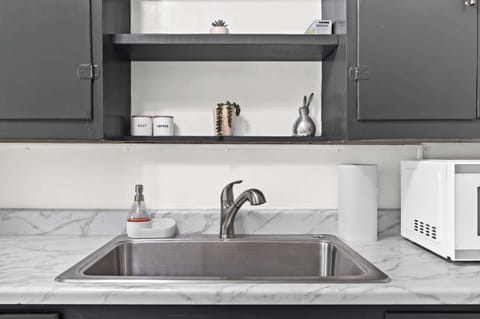 Kitchen: Unit 1 - Cook with ease in this functional kitchen featuring updated appliances and essentials.