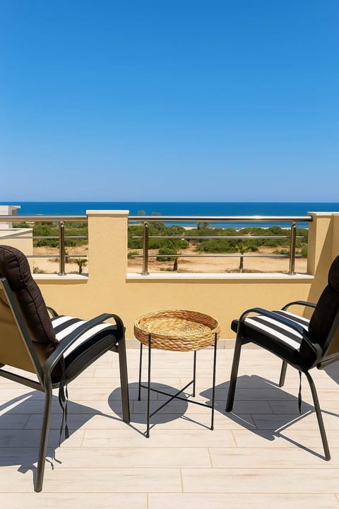 Enjoy your morning coffee with stunning panoramic views of the Aegean Sea.