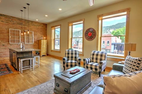 Open floor plan and large windows with downtown views